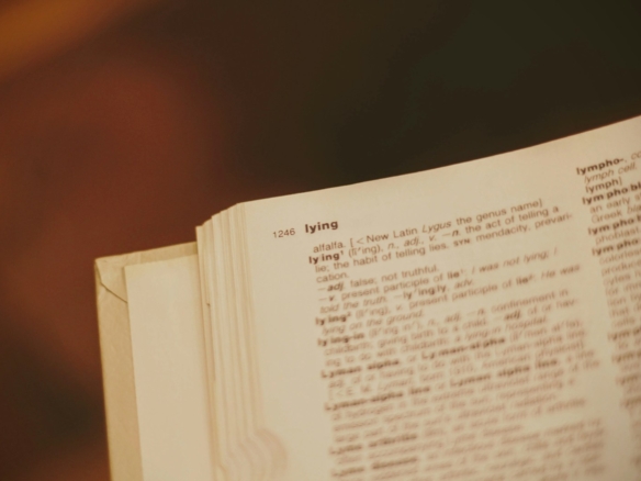 white book page on brown wooden table